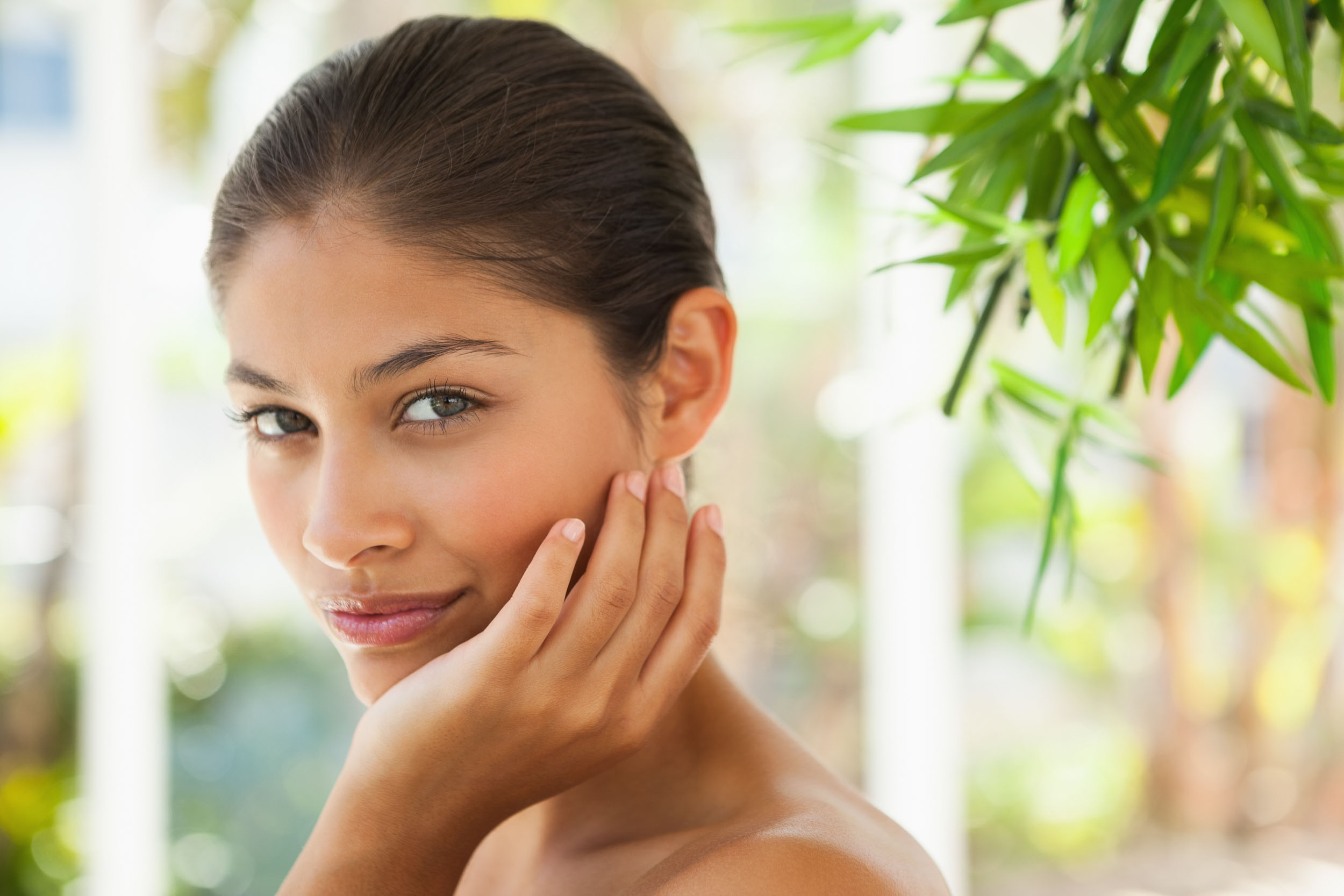 Beautiful brunette smiling representing the med spa